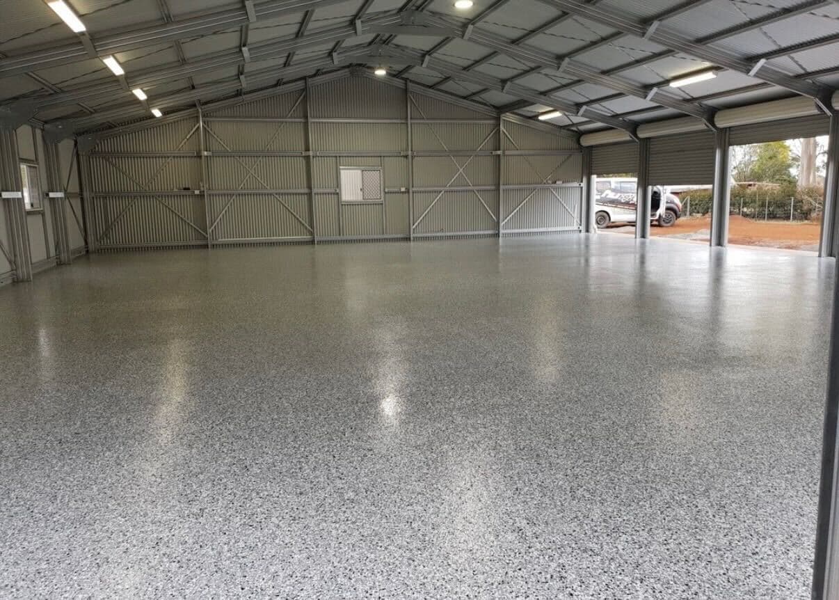 Large commercial shed with light grey epoxy